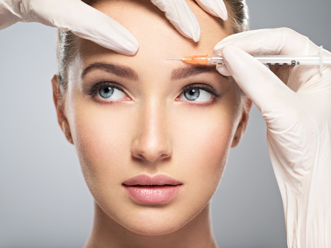women have cosmentic procedure done on eyebrow